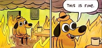The 'This is fine' dog sitting calmly with a cup of coffee while the room burns down around him